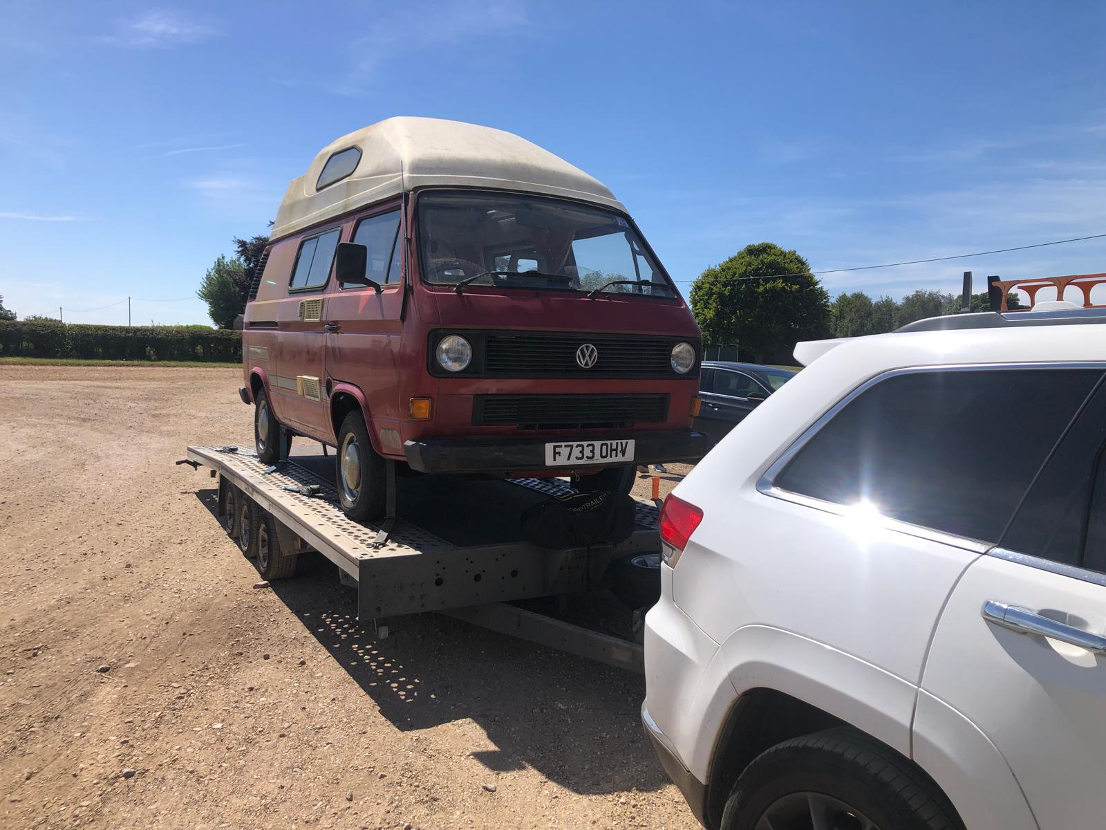 Classic VW camper van on flatbed trailer